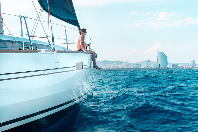 Amazing 2 hour Exclusive Sunset Cruise from Barcelona - Hoisting Sails, Passing the Beaches, and Heading Toward Port Olimpic