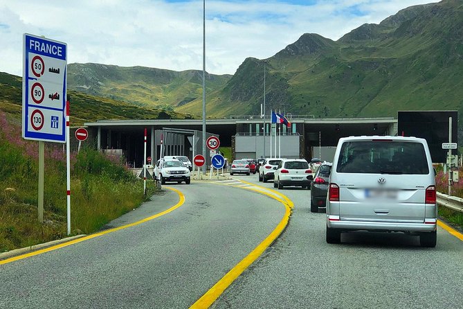 Andorra Original History and Sightseeing Tour (Private, Pickup) - Crossing into Andorra: passport stamp and medieval bridge energy