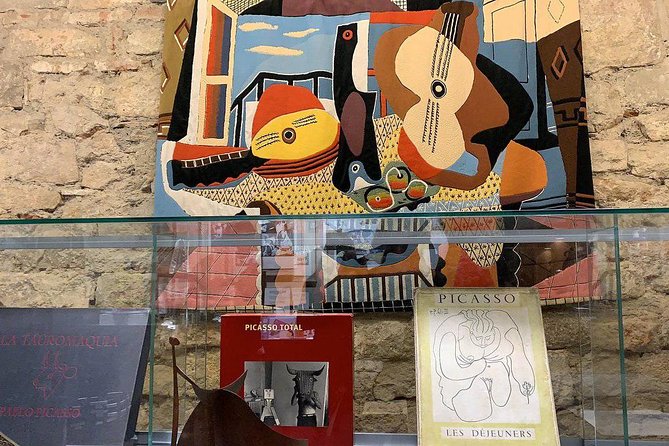 Barcelona Art and Tapas Small Group Walking Tour with Picasso Museum - Plaça Reial Meeting Point: Gaudí Lamps and the Royal Square Story