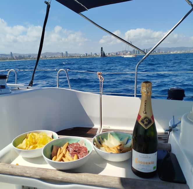 Barcelona Badalona : Sailboat Tour, Snacks, Drinks, Swimming - Aperitif time: cava, beer, vermouth, and the snack that changes the mood