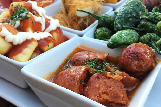 Barcelona Food Tour: Tapas, Drinks and Delights with a Local - Entering with a Local Expert at Plaça de l’Àngel