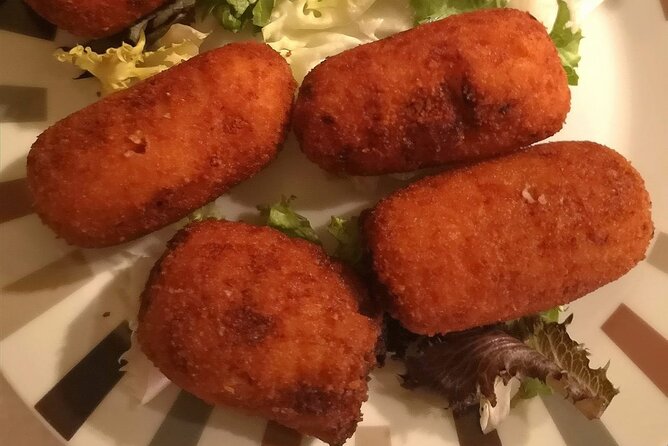 Barcelona Food Tour: Tapas, Drinks and Delights with a Local - Stop 3 on Carrer del Regomir: cava with pimientos and tortilla