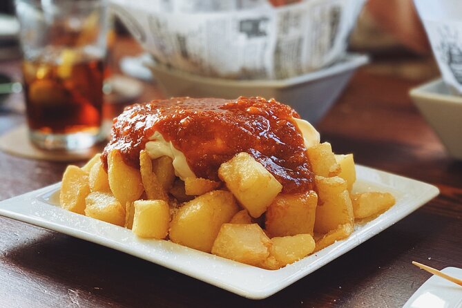 Barcelona Food Tour: Tapas, Drinks and Delights with a Local - Stop 2 on Carrer de la Mercè: a long-running tapas institution