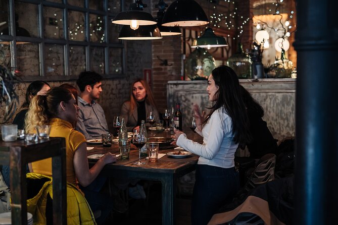 Barcelona: Guided Food Walking Tour with Tapas and Wine - Stops 1–3: croquettes, wine pairings, and a 1945 bodega