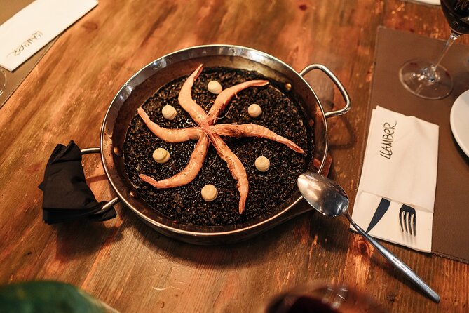 Barcelona: Guided Food Walking Tour with Tapas and Wine - Stop 8 on Carrer d’Avinyó: seafood paella, cava, and dessert