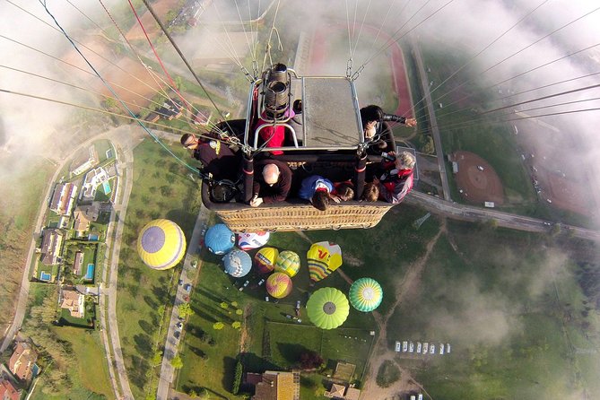 Barcelona: Montserrat Hot Air Balloon Ride with Champagne Toast - Landing day treats: snack, champagne, certificate, and photos