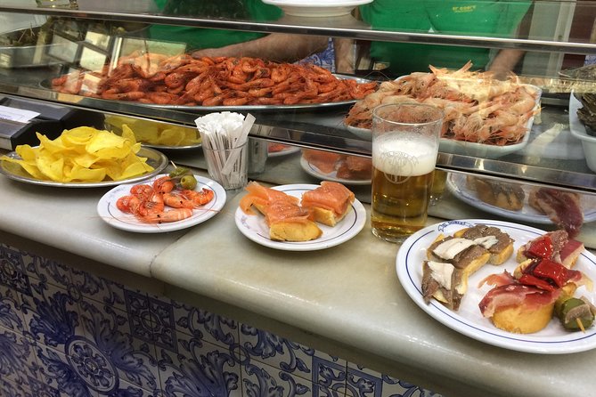Barcelona Morning Tapas Crawl by Food Tour - Starting at Pl. de Catalunya and walking into the Gothic Quarter vibe