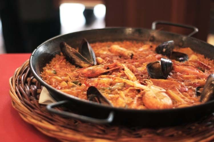 Barcelona: Old Town Tapas & Paella Food Tour with 8 Tastings - The Market Moment: Hams, Cheeses, and Seasonal Produce