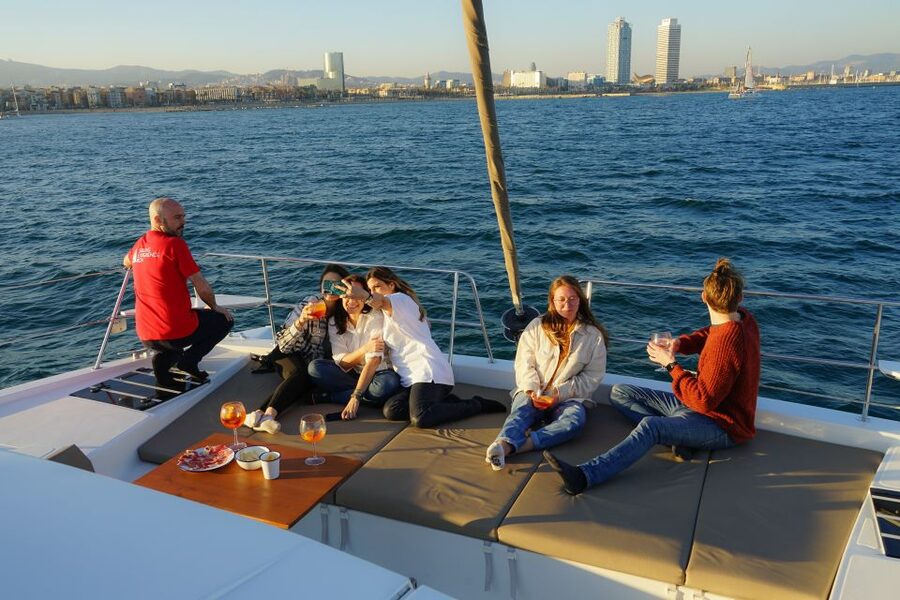 Barcelona: Private Catamaran Sailing with Drinks and Snacks - Deck time: photos, sunbathing, and the sea dip question