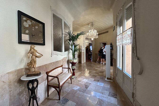 Barcelona: Reserved Entrance to Casa Mila (La Pedrera) with Audio - Rooftop Highlights: Views, Sculptures, and What to Watch For