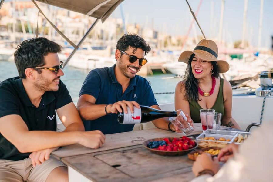 Barcelona: Sailing Cruise & Vineyard Tour with Wine Tasting - The sailing from Barcelona: Port Olímpic views, snacks, and the wind factor