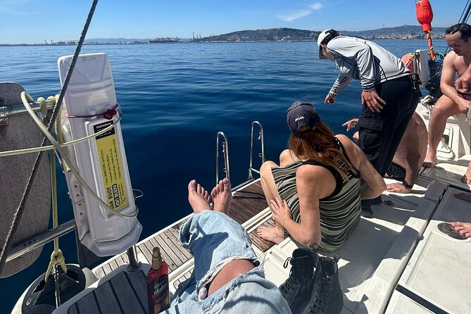 Barcelona: Sailing Tour with Tapas, Drinks, Swim & Sunset Option - The swim stop in the Mediterranean: when it happens and how to handle it