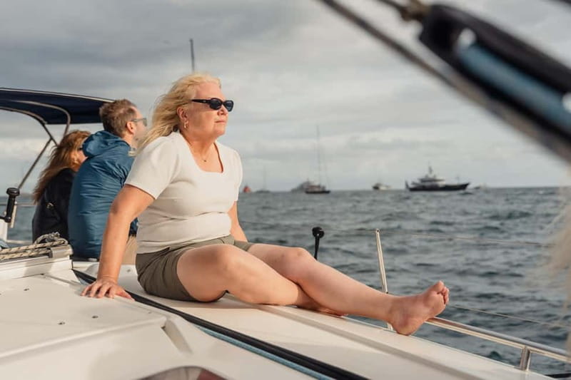 Barcelona: Sailing Tour with Young Local Captain & Drinks - Port Vell by sailboat: yachts, waterfront sights, and an instant change of pace