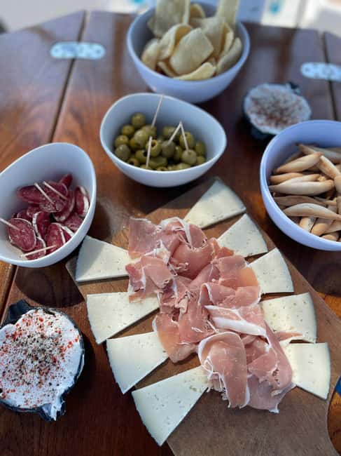 Barcelona: Sailing with Open Bar, Catalan Snack & Swim Stop - On-board vibe: music, drinks, and Catalan snacks that actually matter