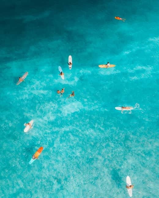 Barcelona: Sunrise or Sunset Paddle Surf with Photos - Gear up without fuss: wetsuit, life jacket, locker, and real comfort