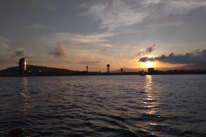 Barcelona Sunset Cruise with Light Snacks and Open Bar - Cruising the Waterfront With Skipper Stories and Light Bites