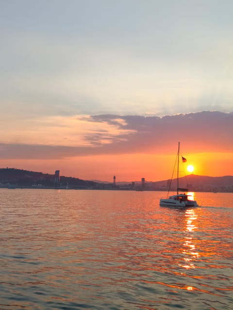 Barcelona: Sunset Cruise with Snacks and Drinks - The safety briefing and sailing out: what changes after departure