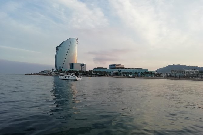 Barcelona Sunset Sailing Cruise from Port Olímpic with Open Bar - First Stop Inside Port Olímpic: Whale, Olympic Towers, and Quiet Water
