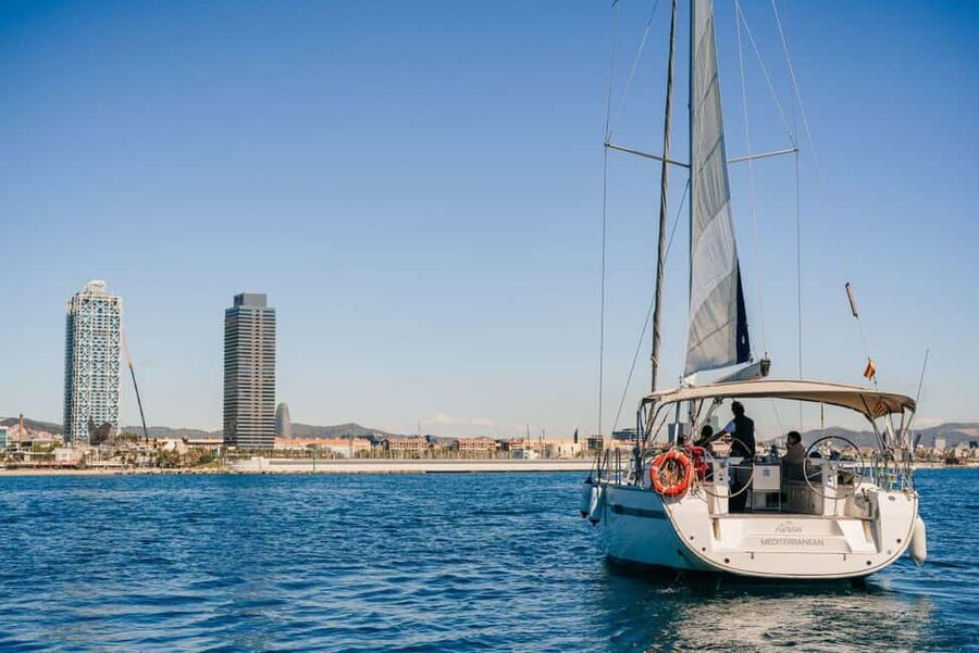 Barcelona Sunset Sailing Experience with open bar and snakcs - What you’ll see lit up: Sagrada Familia, Tibidabo, and the W Hotel