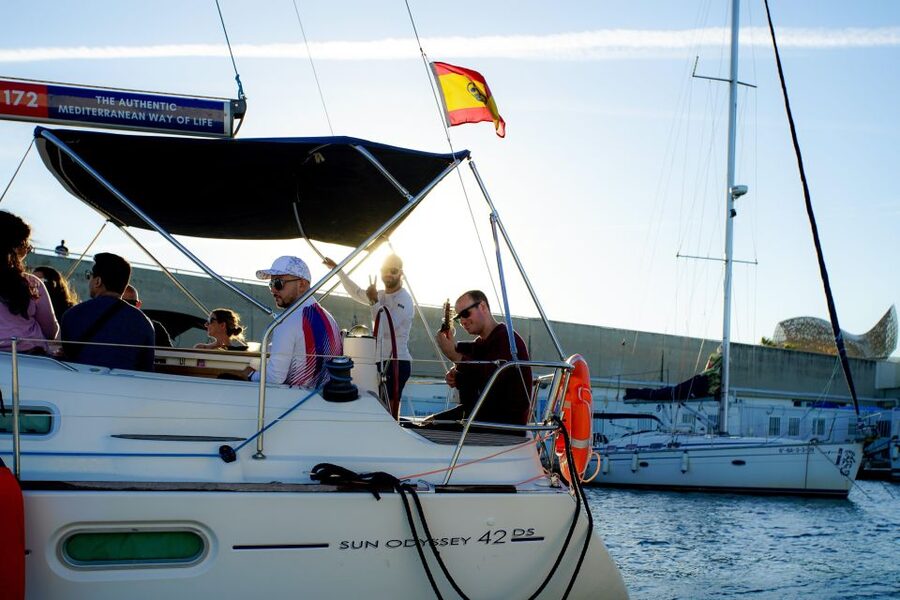 Barcelona: Sunset Sailing with Live Guitar Music and Tapas - Port Olimpic and the Bombon: the setting that makes the views easy