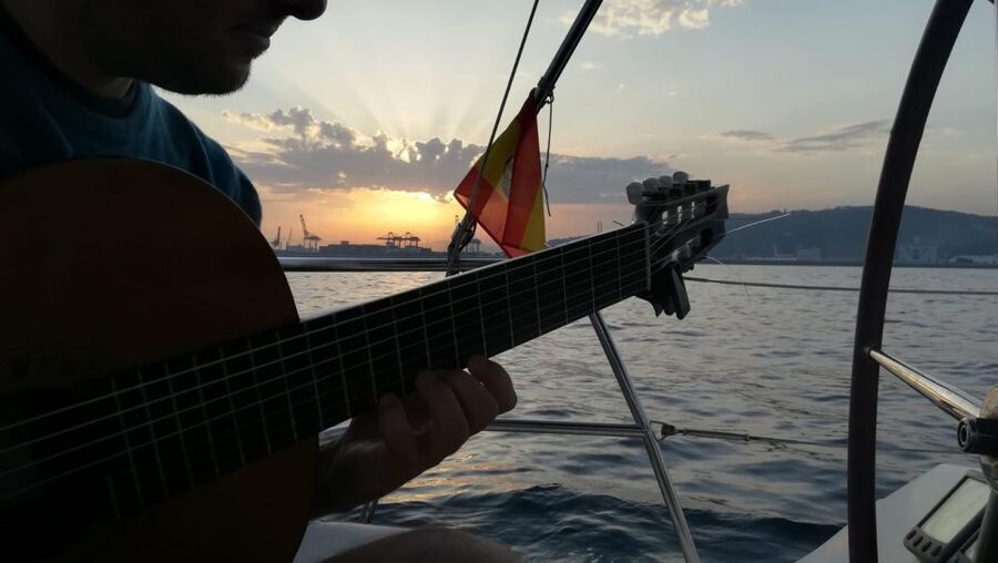 Barcelona: Sunset Sailing with Live Guitar Music and Tapas - Live Spanish guitar on a moving boat: the real heart of the evening