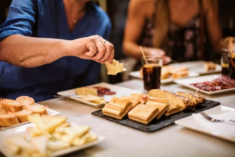 Barcelona: Tapas, Wine & History Tour of the Old Town - The early-1900s sit-down finish: shared plates, red wine, dessert