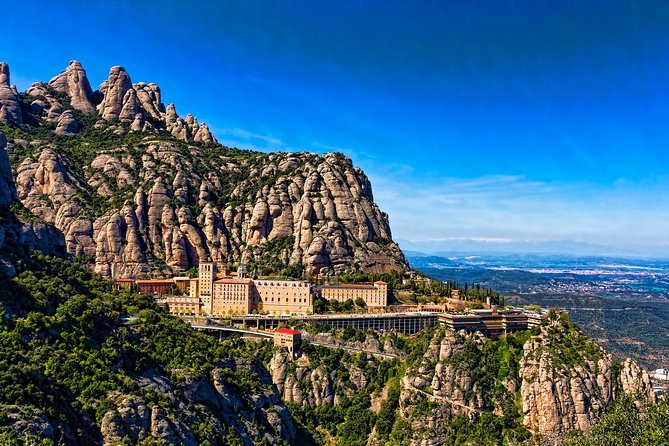 Best of Barcelona and Montserrat: Pickup and Skip-the-Line Ticket - Barcelona highlights: Montjuïc views, Gaudí stops, and the modernist trio area