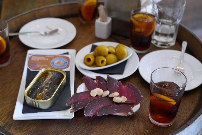 Born to Eat: Gourmet Tapas & Wine Small Group Tour in Old Barcelona - Your aperitif kickoff: vermut, alleyways, and Catalan politics