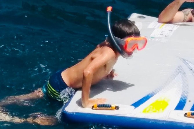 Catamaran ride -Costa Brava with barbecue and drinks. Familiar. - What to Pack: Shoes On, Sunscreen On, and Warm Layers