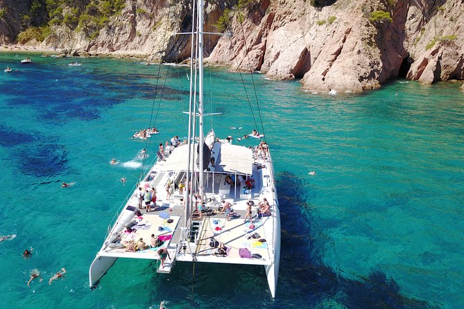 Catamaran trip with other groups along the Costa Brava. Saturday. - Where It Starts: Lloret de Mar Meeting Point and Easy Start