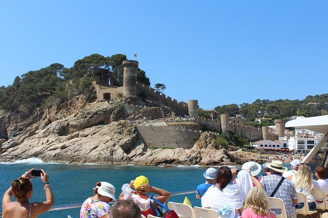 Costa Brava Day Sightseeing Tour with Boat Trip from Barcelona - Lloret de Mar: shopping streets, Saint Roma church, and beach views