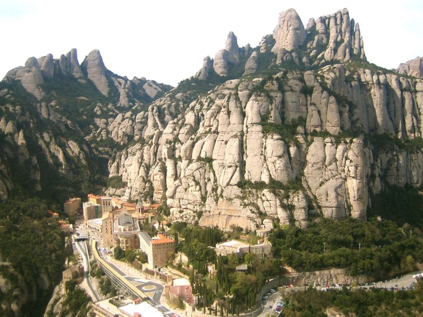 From Barcelona: Montserrat Full-Day Trip with Guided Hike - The glass-roof funicular to St. Joan: a smart warm-up
