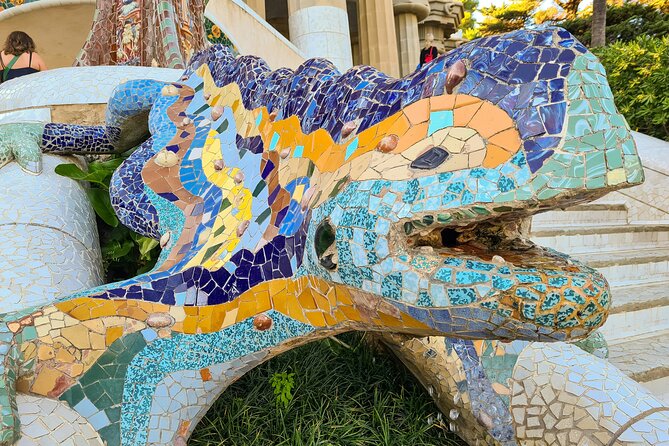 Gaudis Sunset Sagrada Familia and Parc Güell Guided English Tour - Park Güell main entrance: the serpentine bench and the uphill reality