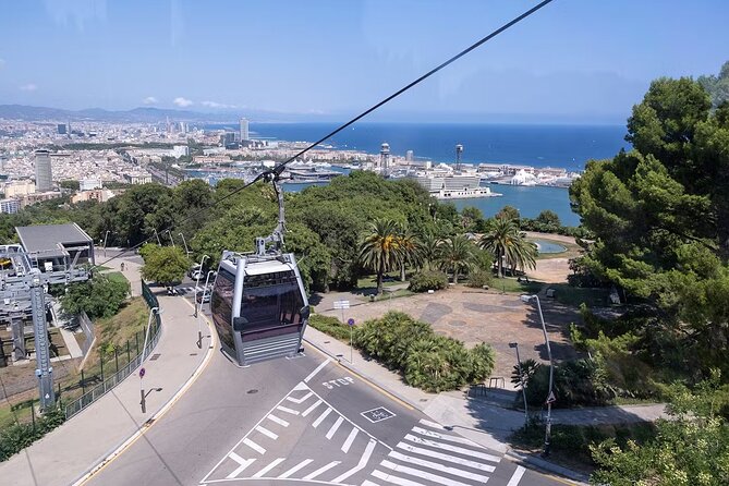 Montjuïc Cable Car Roundtrip Tickets - Montjuïc at the Top: Cliffs, Green Spaces, and Landmarks