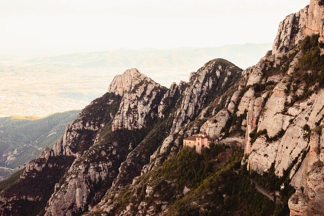 Montserrat Skip the Crowds & Choir Afternoon Tour from Barcelona - The air-conditioned ride from city noise to Montserrat’s cliffs