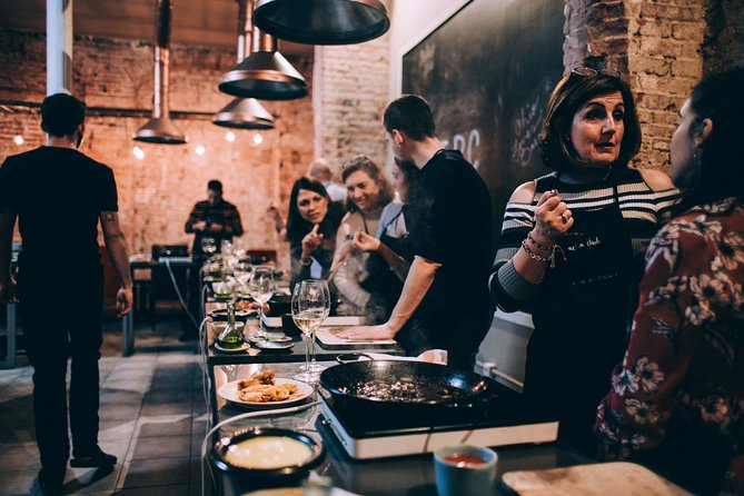 Paella Cooking Class with Professional Chef: Four Course Dinner - El Raval and the Paella Club setting: where your night starts