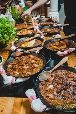 Paella Experience and Bottomless Wine in Barcelona - Five Courses at the Table: Starters, Paella, Sorbet, Chocolate