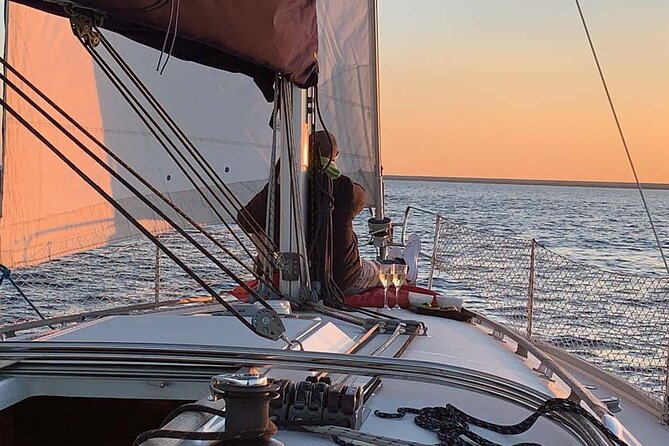 Sunset at PREMIUM Boat in Barcelona - Seasonal Fun: Blankets in Winter, Paddle Surfing in Summer