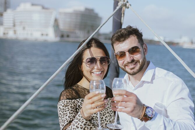 Sunset Sailboat Tour along the Coast with Open Bar - Boarding at Port Olímpic: Getting on the water with minimal fuss