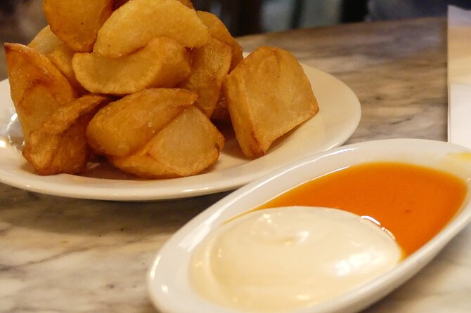 Tapas and Wine Walking Tour in Barcelona - El Raval: a different kind of Barcelona night with tapas and wine